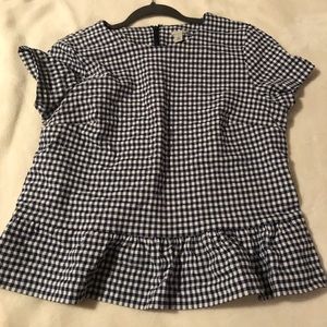 Checkered blue and white blouse.